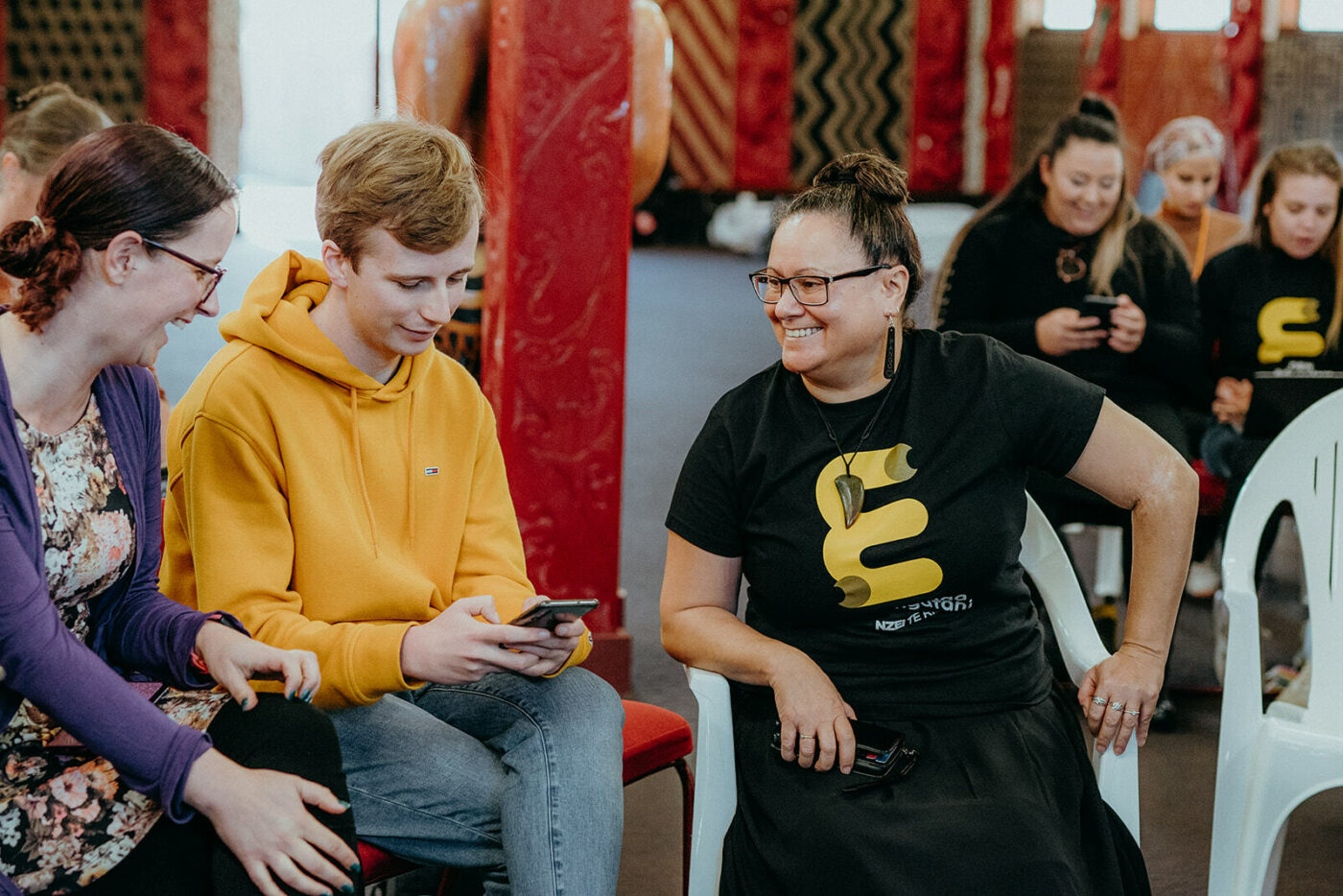 Student members and staff talking.